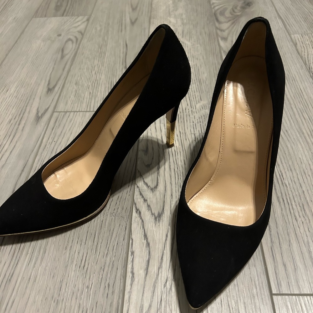 Black velvet heels with gold accent on the heel
